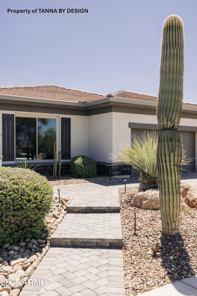 property entrance featuring a garage