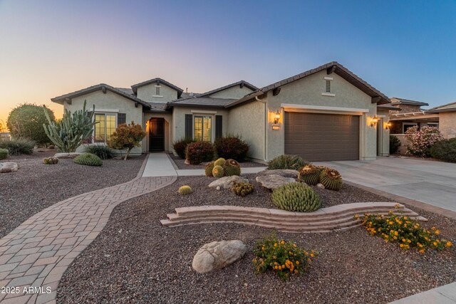 20506 N 271st Ave, Buckeye, AZ 85396 - ranch-style house featuring a garage, driveway, and stucco siding