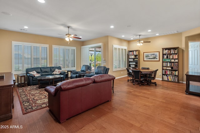 20506 N 271st Ave, Buckeye, AZ 85396 - living area featuring visible vents, a ceiling fan, and light wood-style flooring