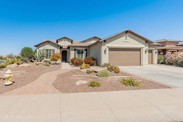 20506 N 271st Ave, Buckeye, AZ 85396 - mediterranean / spanish-style home featuring an attached garage, stucco siding, driveway, and a tiled roof