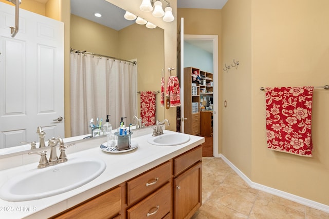 20506 N 271st Ave, Buckeye, AZ 85396 - full bath with tile patterned flooring, a sink, baseboards, and double vanity