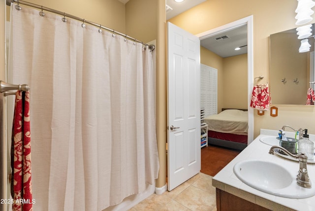 20506 N 271st Ave, Buckeye, AZ 85396 - bathroom with double vanity, visible vents, a sink, and tile patterned flooring