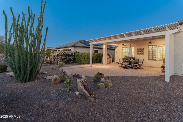 20506 N 271st Ave, Buckeye, AZ 85396 - rear view of house featuring ceiling fan, a patio area, stucco siding, and fence
