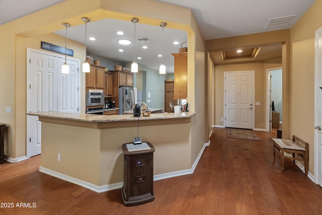 20506 N 271st Ave, Buckeye, AZ 85396 - kitchen featuring stainless steel fridge, brown cabinets, dark wood finished floors, and visible vents