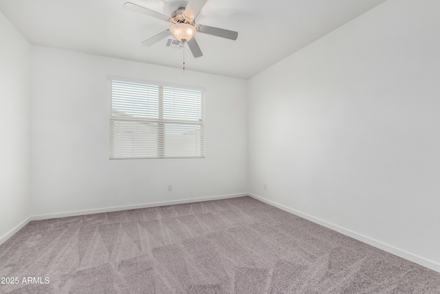 unfurnished room with ceiling fan, carpet, visible vents, and baseboards