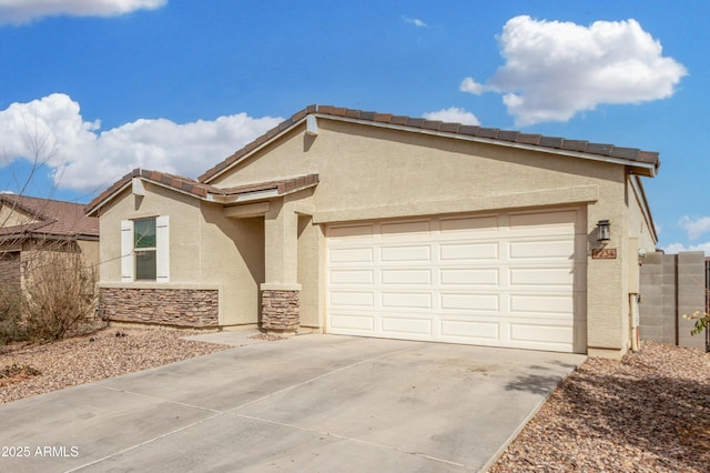 view of front of property with stone siding, concrete driveway, an attached garage, and stucco siding