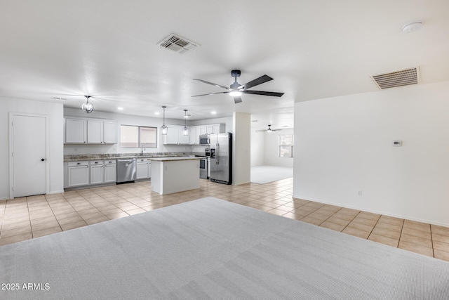 kitchen featuring light tile patterned floors, visible vents, appliances with stainless steel finishes, and ceiling fan