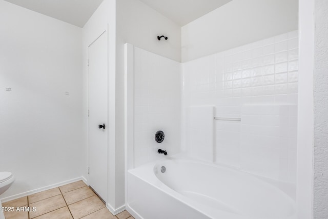 full bath with tile patterned floors, toilet, baseboards, and shower / bathing tub combination