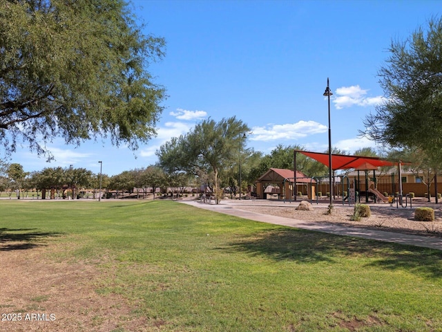 view of community featuring a playground and a yard