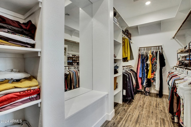 spacious closet with hardwood / wood-style flooring