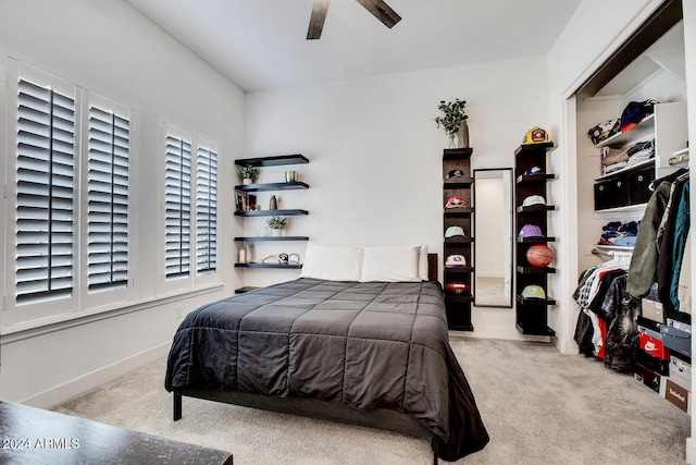 bedroom with light carpet, a closet, and ceiling fan