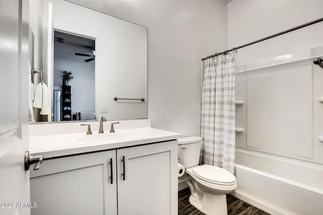 full bathroom with shower / tub combo, vanity, toilet, and hardwood / wood-style floors