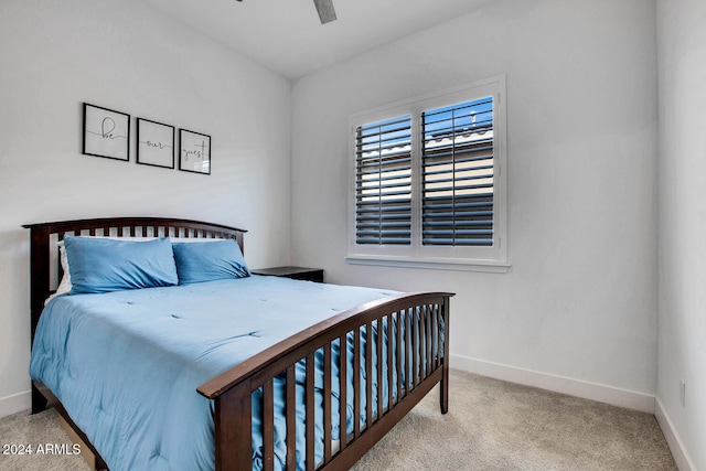 bedroom with ceiling fan and light carpet