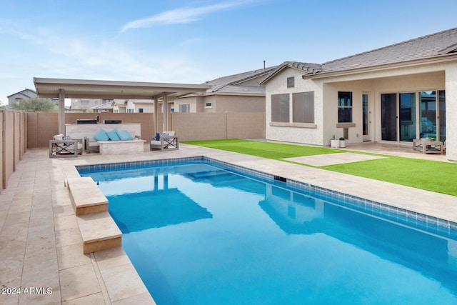 view of pool featuring an outdoor living space and a patio area