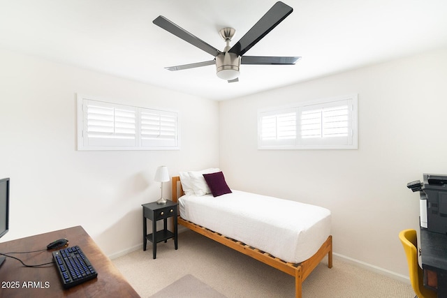 bedroom with ceiling fan and light colored carpet