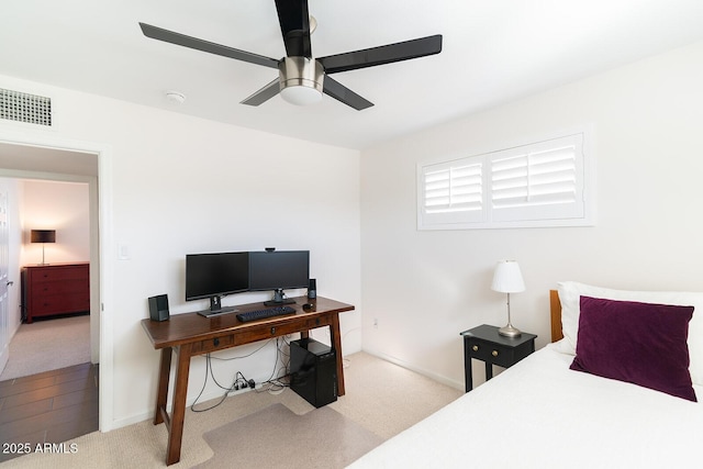 bedroom with light colored carpet and ceiling fan