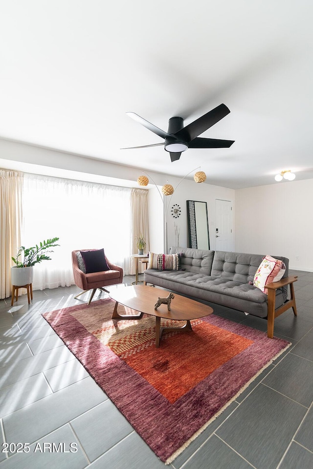 tiled living room featuring ceiling fan