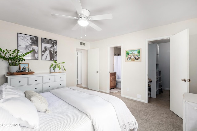 carpeted bedroom featuring ensuite bathroom and ceiling fan