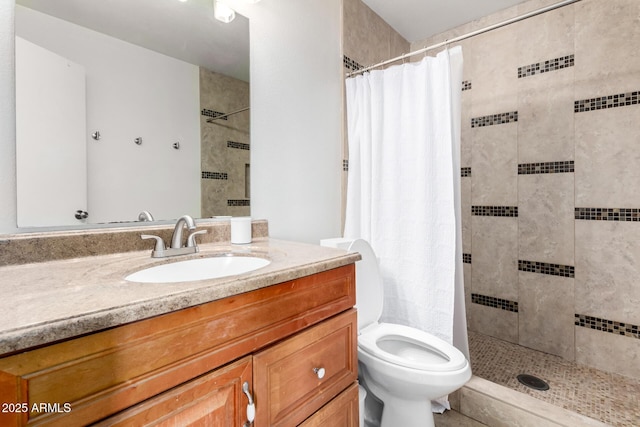 bathroom featuring a shower with curtain, vanity, and toilet