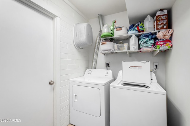 laundry area with washing machine and clothes dryer