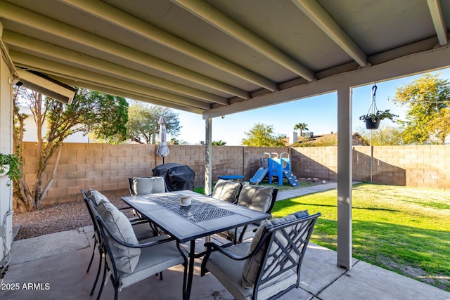 view of patio / terrace with a playground and a grill