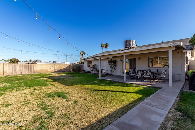 view of yard featuring a patio and central air condition unit