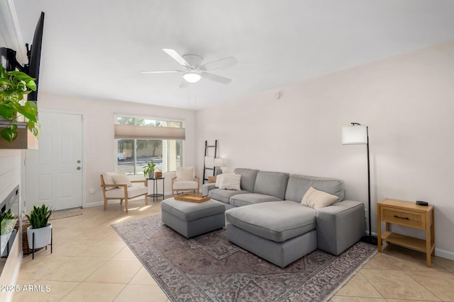 living room with light tile patterned floors and ceiling fan