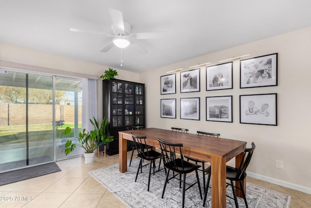 dining area featuring light tile patterned floors and ceiling fan