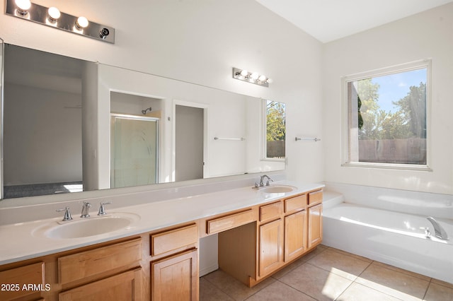 bathroom with vanity, plus walk in shower, and tile patterned flooring