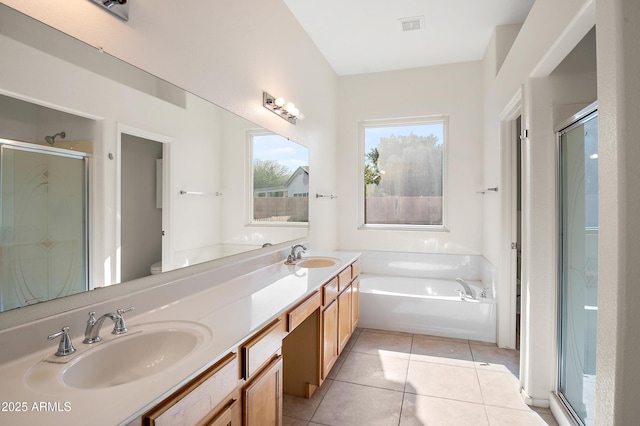 full bathroom with tile patterned flooring, vanity, independent shower and bath, and toilet