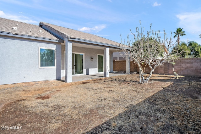 back of property featuring a patio area