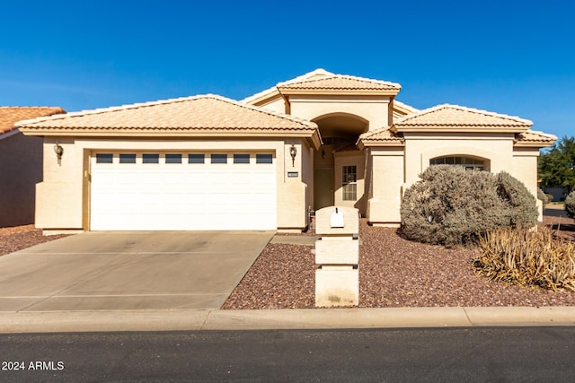 view of front of property with a garage