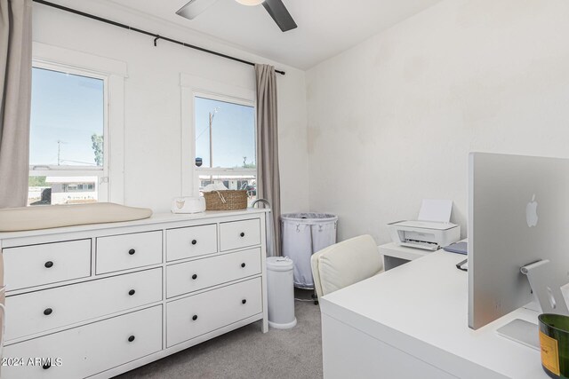 carpeted office with ceiling fan