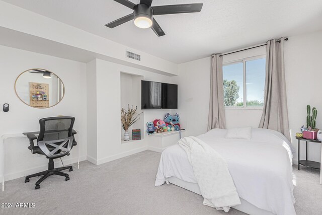 carpeted bedroom featuring ceiling fan