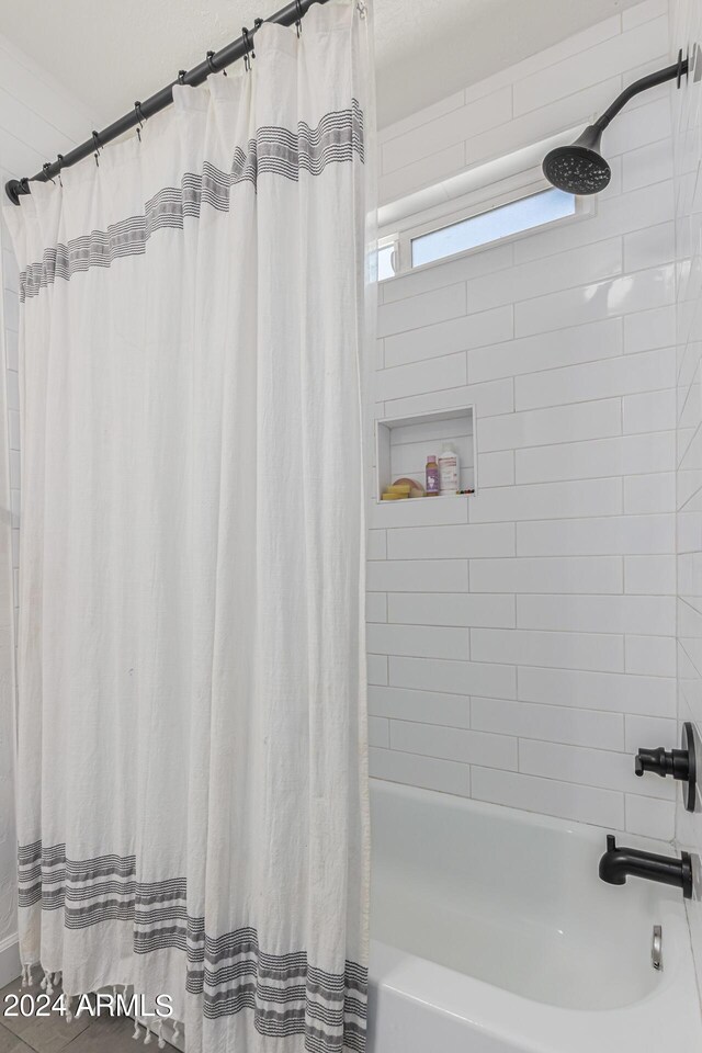 bathroom featuring shower / bath combination with curtain