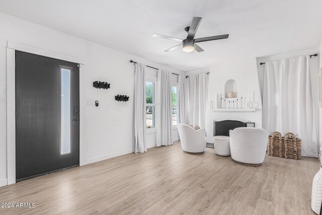 interior space featuring ceiling fan and light hardwood / wood-style flooring