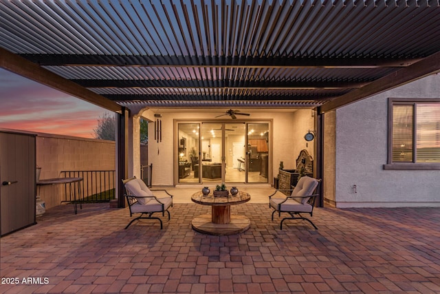 11658 E Chevelon Trl, Gold Canyon, AZ 85118 - patio terrace at dusk featuring a ceiling fan and a patio