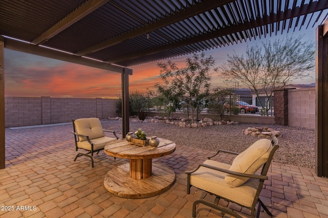 11658 E Chevelon Trl, Gold Canyon, AZ 85118 - patio terrace at dusk featuring a patio area and a fenced backyard