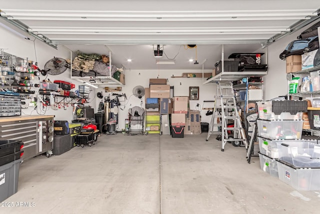 11658 E Chevelon Trl, Gold Canyon, AZ 85118 - garage featuring a garage door opener and a workshop area