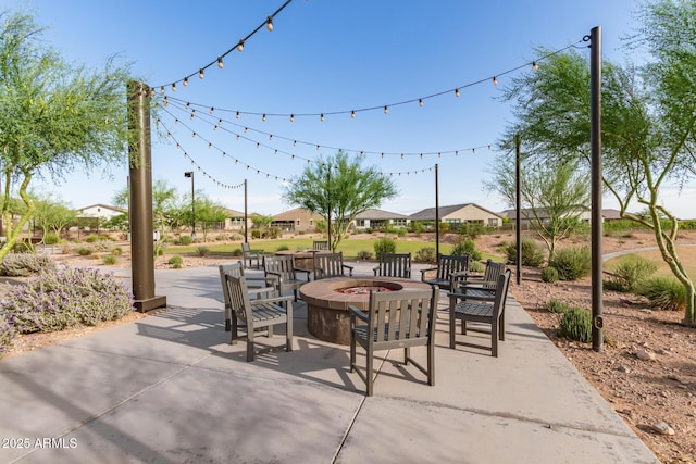 11658 E Chevelon Trl, Gold Canyon, AZ 85118 - view of patio / terrace featuring a fire pit