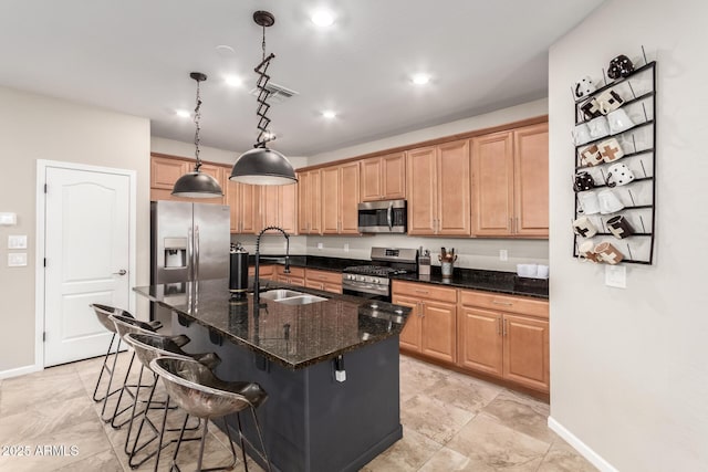 11658 E Chevelon Trl, Gold Canyon, AZ 85118 - kitchen featuring appliances with stainless steel finishes, a sink, a center island with sink, a kitchen bar, and dark stone counters