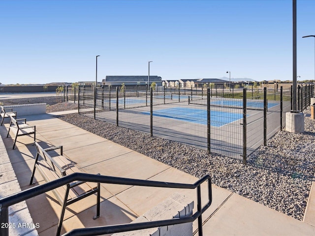 exterior space with fence, a swimming pool, and a patio