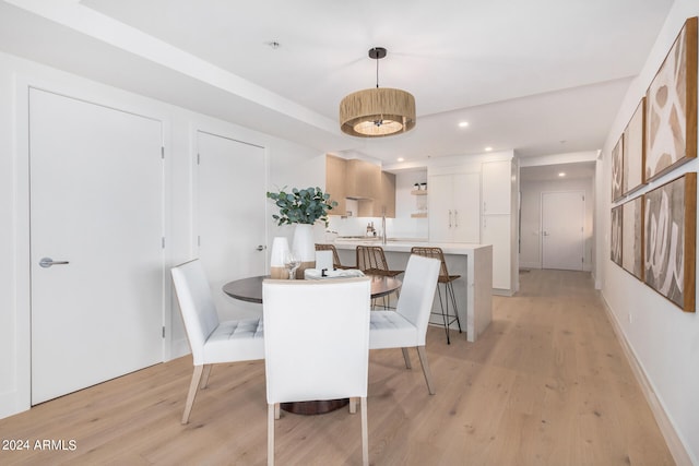 dining area featuring light wood-type flooring