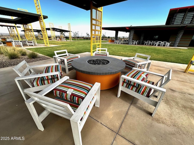 view of patio with a fire pit