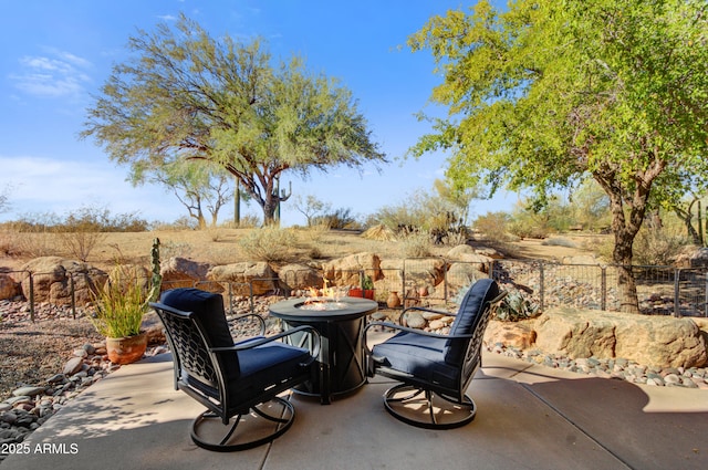 view of patio / terrace with an outdoor fire pit