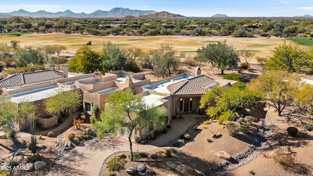 birds eye view of property featuring a mountain view