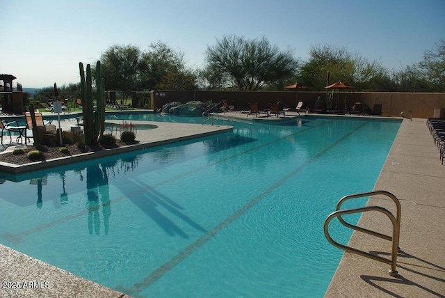 view of swimming pool featuring a patio area