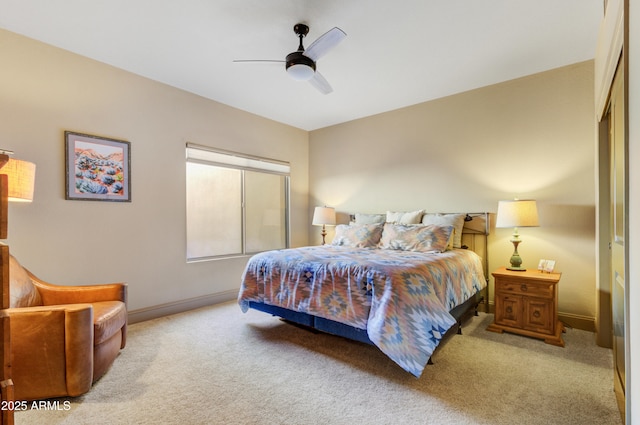 bedroom with light carpet and ceiling fan