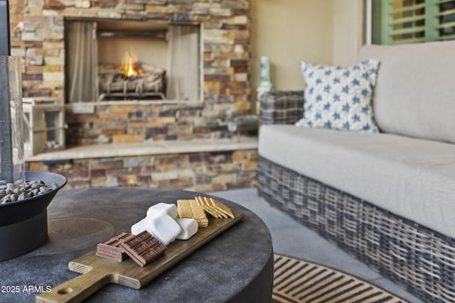 3770 E Ringtail Way, Phoenix, AZ 85050 - living room featuring a lit fireplace