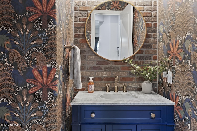 3770 E Ringtail Way, Phoenix, AZ 85050 - bathroom with vanity and brick wall